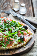 Pulling the cheese on freshly baked pizza