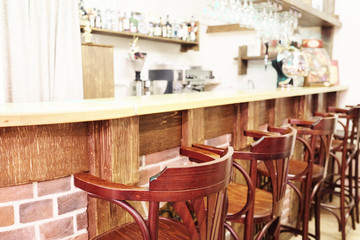 Bar stools in a row by the counter