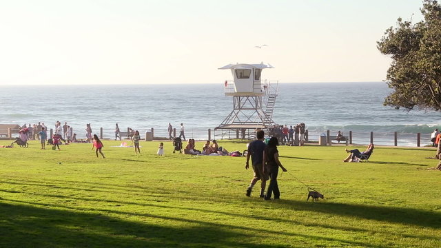 Tourists vacationing at San Diego beach on a bright summer day
