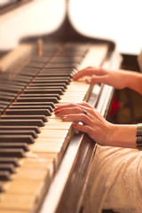 Young woman playing piano © chaossart