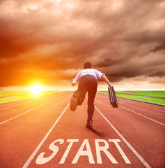 businessman running for race on the track