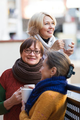 Senior women drinking tea at balcony