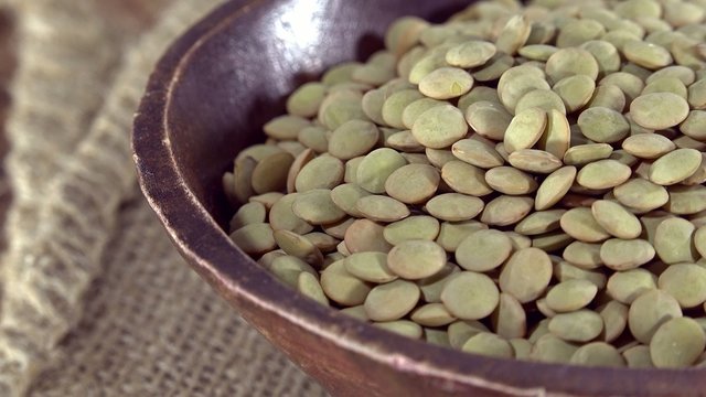 Portion of seamless loopable brown Lentils (4k UHD footage)