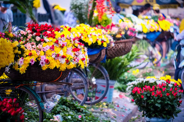 Fototapeta na wymiar Flower bicycle at small market for florist vendor in Hanoi, Vietnam