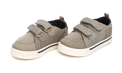 pair of grey shoes on a white background close up