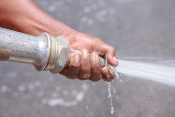 Street sprayed clean with pressurized water, wet cleaning of str