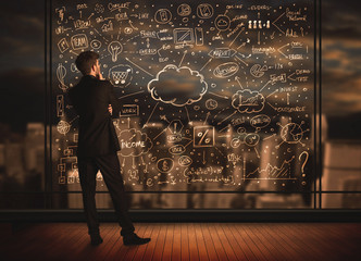 Businessman drawing business plan