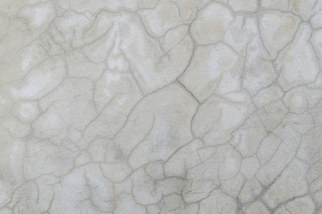 abstract of cement cracked texture on old white masonry wall