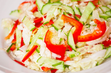 Chinese cabbage salad with red bell pepper and cucumber