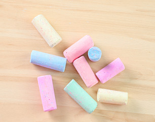 colorful chalk on wooden board