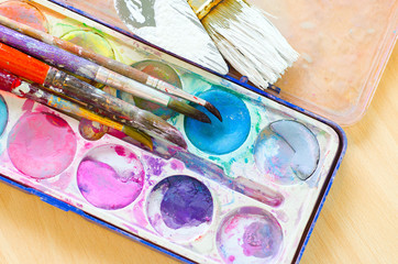 Obraz premium palette with watercolor ink and brush