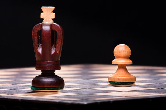 chess king with pawn