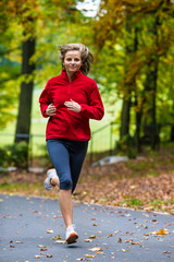 Healthy lifestyle - woman running in park