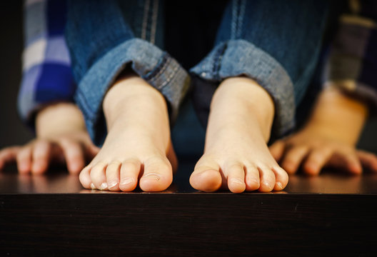 Little girl with bare foot