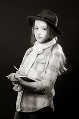 Fototapeta premium Cute teenage girl with father's hat close-up portrait