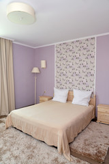 Interior of a bedroom of a double hotel room in light tones
