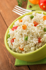 bowl full of rice isolated on wood