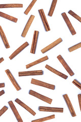 Scattered aromatic cinnamon sticks.