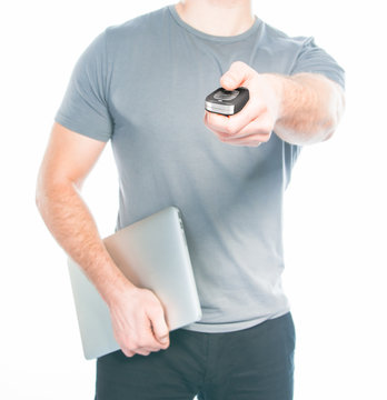 Man with a remote control from the car in the hands