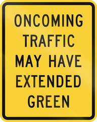 Fototapeta premium US road warning sign: Oncoming traffic may have extended green