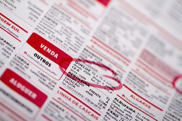 Obraz premium Newspaper ads of a mix of stuff including rental, vacations.