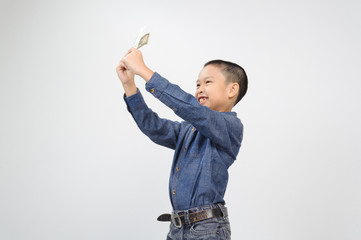Young boy with happy and smile with american dollar bank note