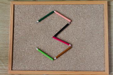 Board and numbered and colored pencils