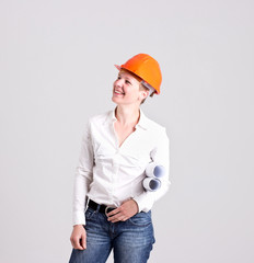 Archictress in Safety Helmet is Holding a Building Plans