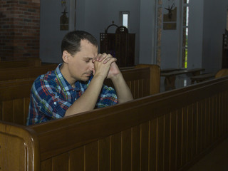 Man praying in church