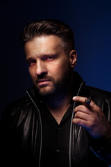 Portrait of a tough guy smoking cigar