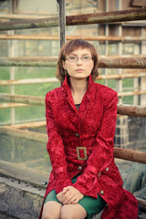 Young woman in red coat