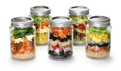 vegetable salad in glass jar on white background