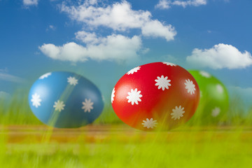 Colored Easter eggs on blue sky background