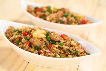 Chinese fried rice with vegetables, chicken and fried eggs