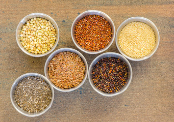 Collection of healthy grain in round metal containers
