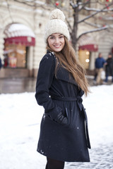 Young beautiful woman in stylish dark gray wool coat