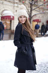 Young beautiful woman in stylish dark gray wool coat