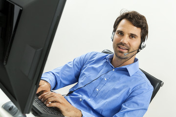 Man wearing headset giving online chat and support