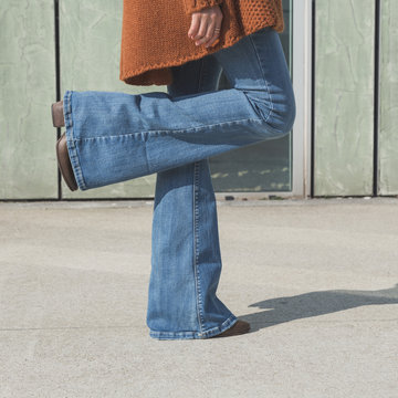 Detail of a girl posing in an urban context