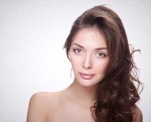 Fototapeta premium Close up portrait of beautiful young woman face. Isolated on