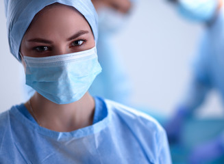 Team surgeon at work in operating room.