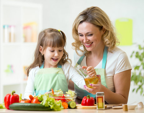 mother and kid preparing healthy food