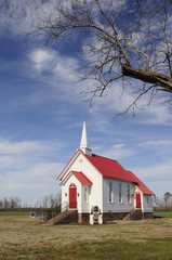 Chapel with White Wood Siding and Red Roof