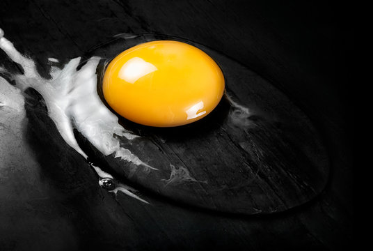 Raw Egg on Smooth Black Surface
