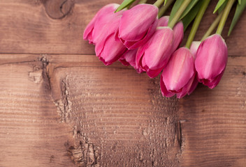 Tulips flowers on wooden table