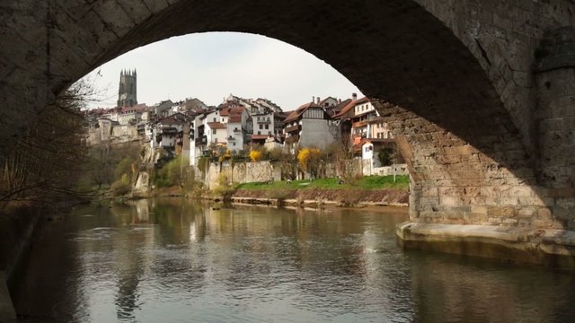 Ancient stone bridge Pont du Milieu in Fribourg, Switzerland