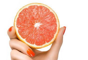 Female Hand Holding a Luscious Healthy Grapefruit. Isolated