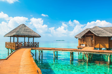 Over water bungalows with steps into amazing green lagoon