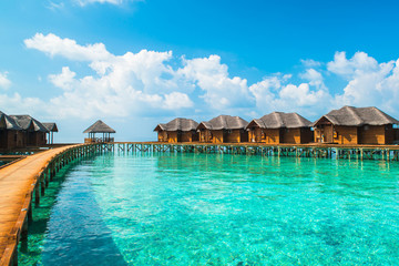 Over water bungalows with steps into amazing green lagoon