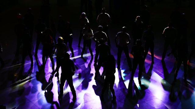 Silhouettes of dancing at the disco